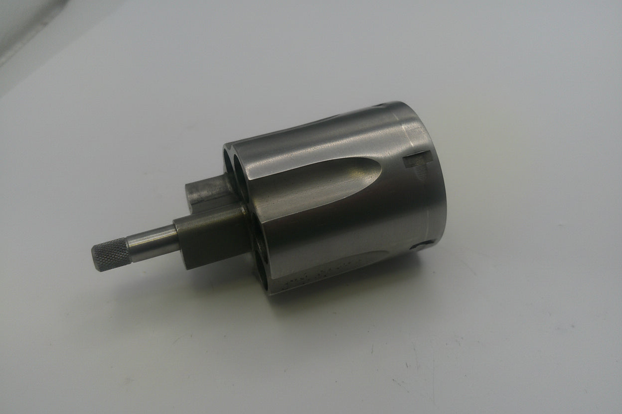 Metal drill bit on a white surface