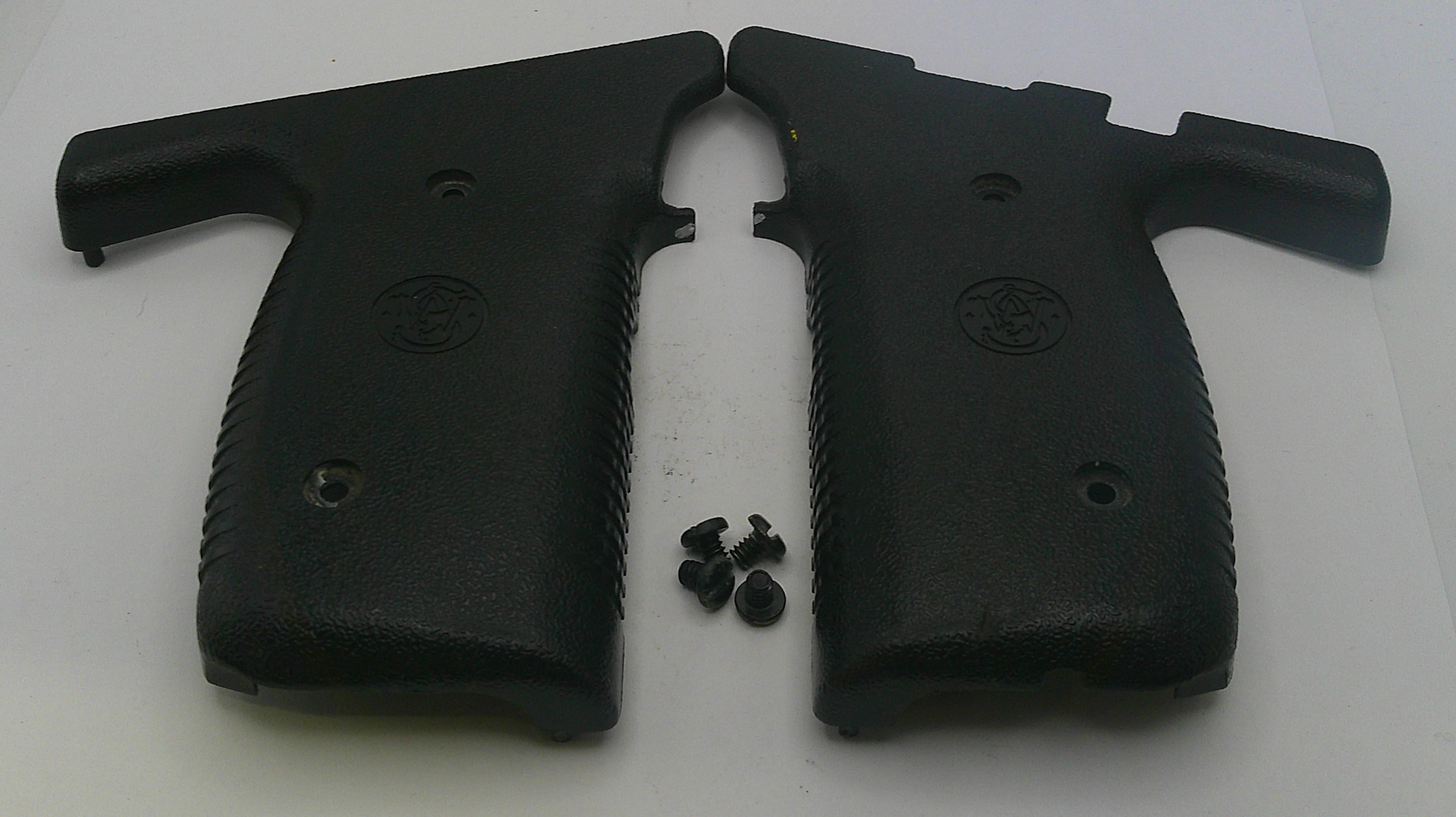 Two black gun grips with screws on a white background