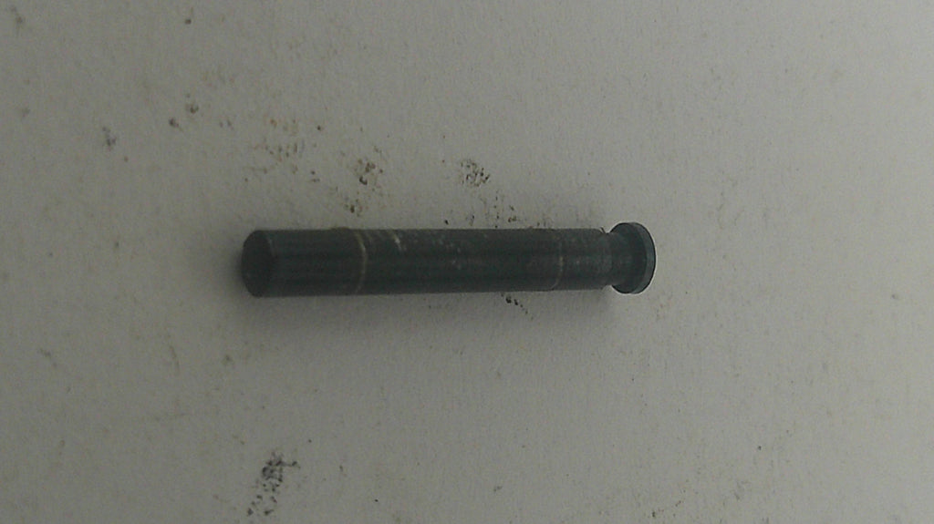 Black cylindrical object on a light gray background