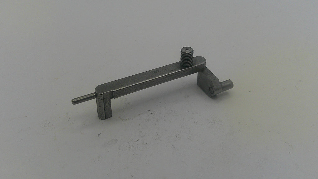 Metal tool on a light gray background