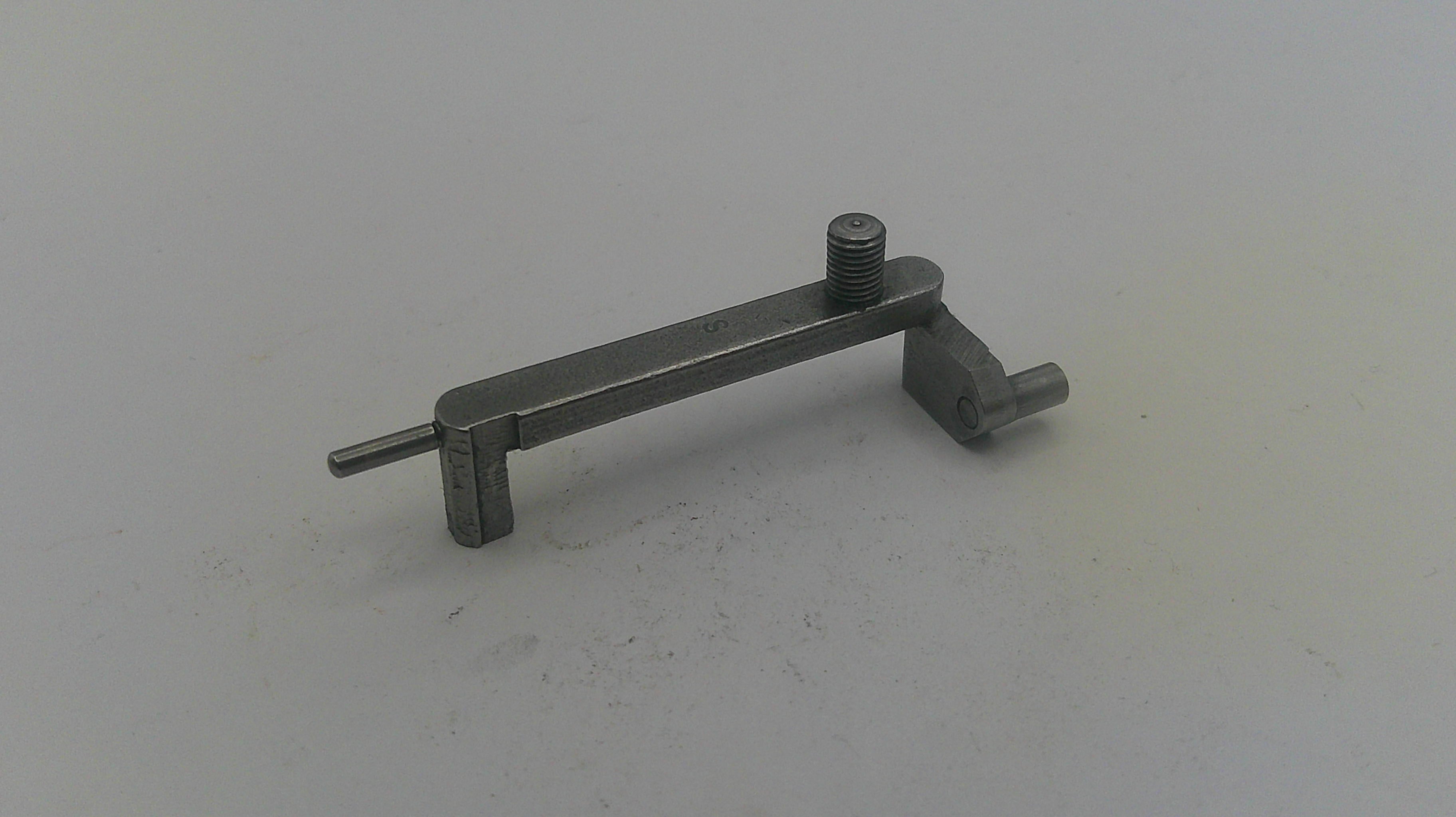 Metal tool on a light gray background