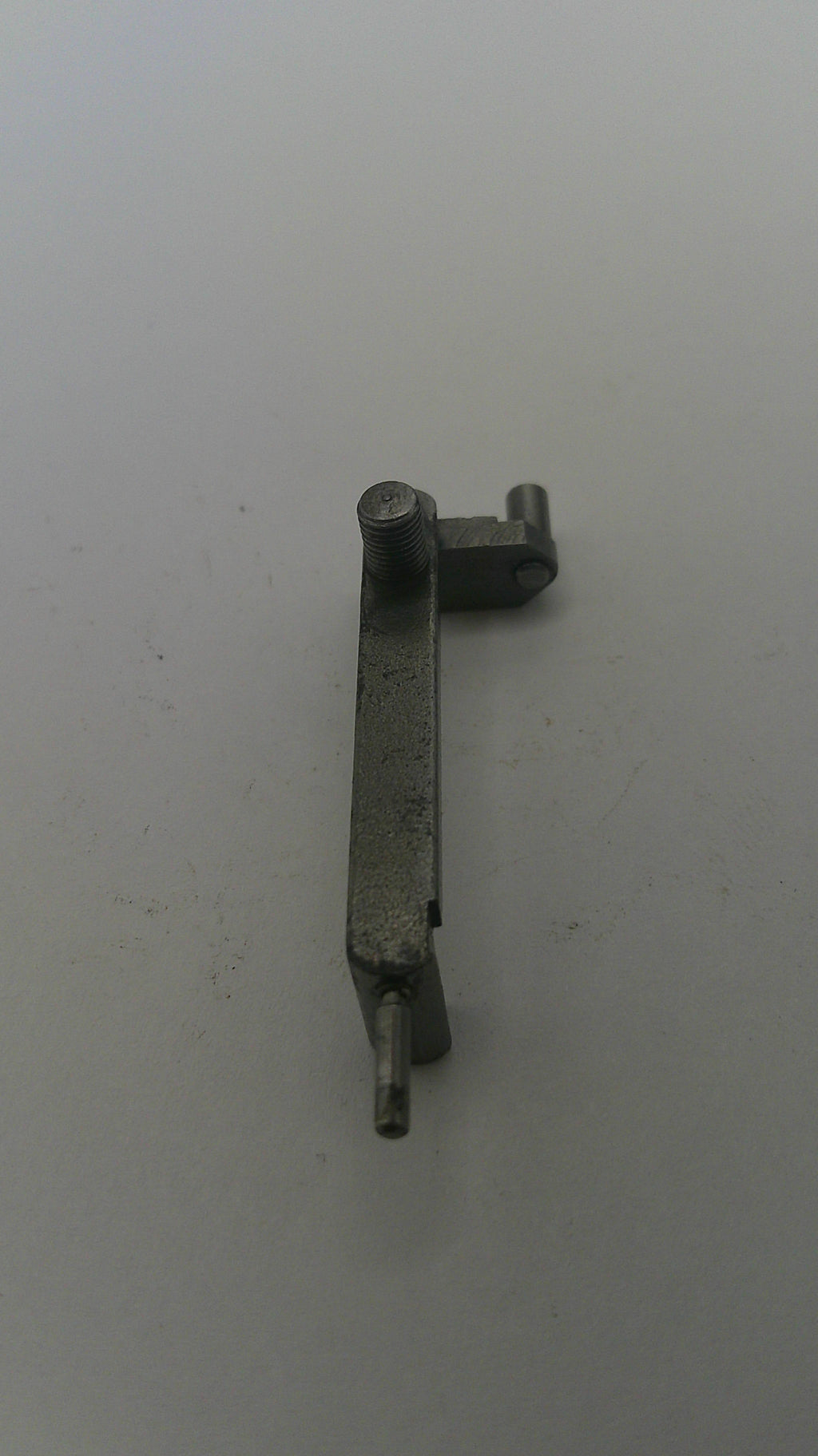 Metal mechanical component on a plain background