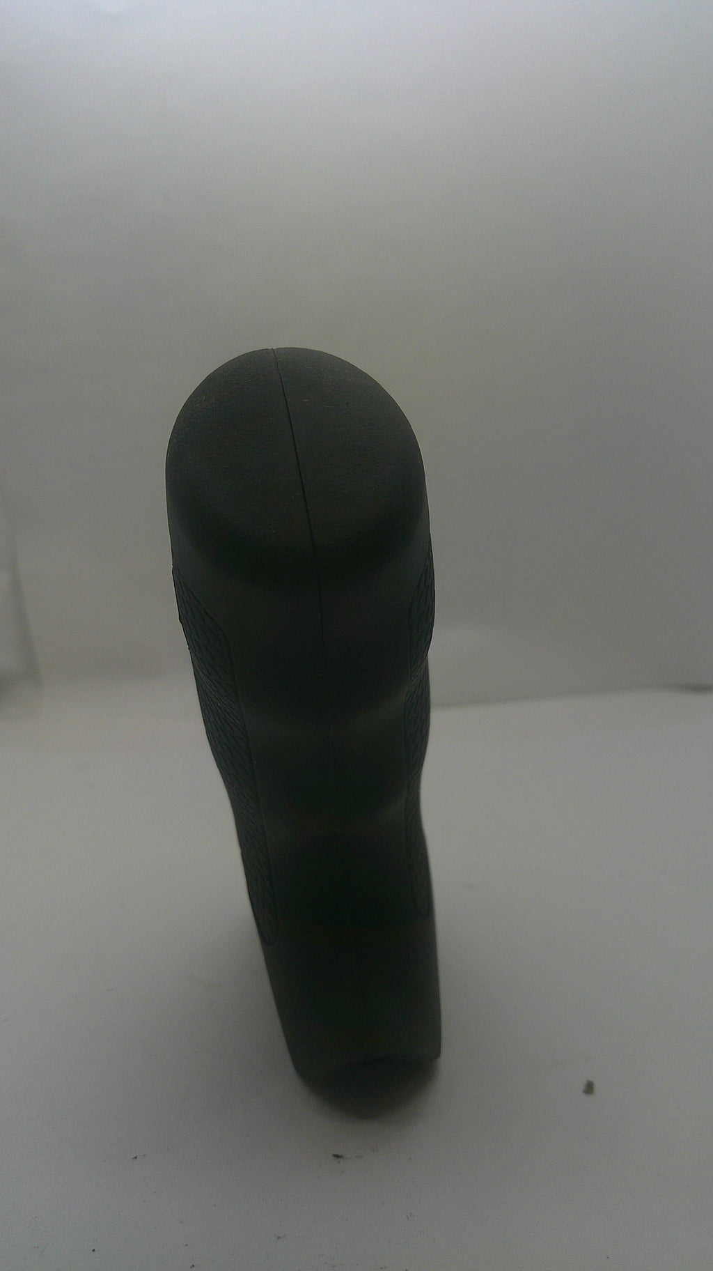 A black plastic cylindrical handle or grip shown from an angled perspective against a plain white background.