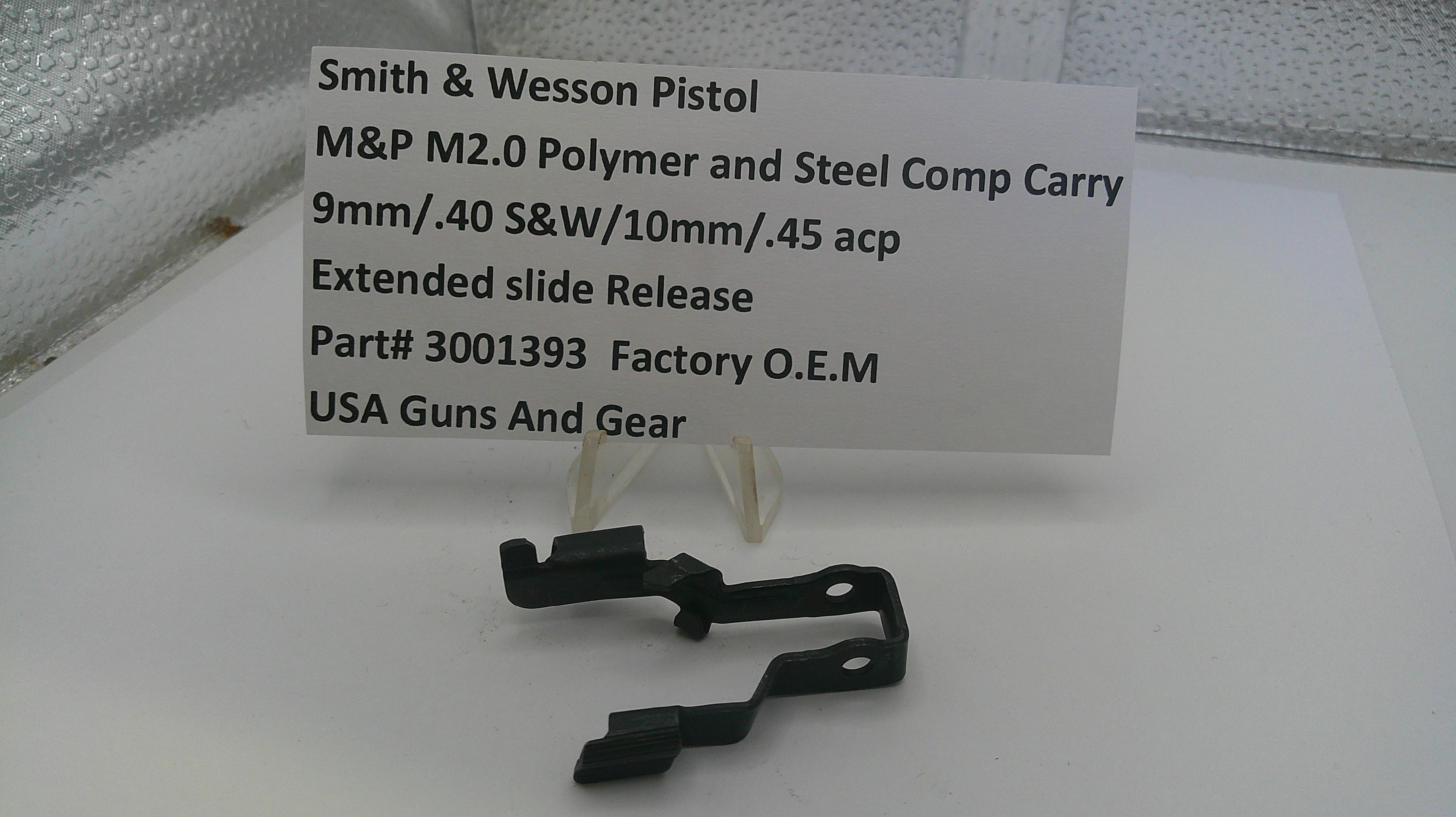 Black gun slide component with a label on a white surface