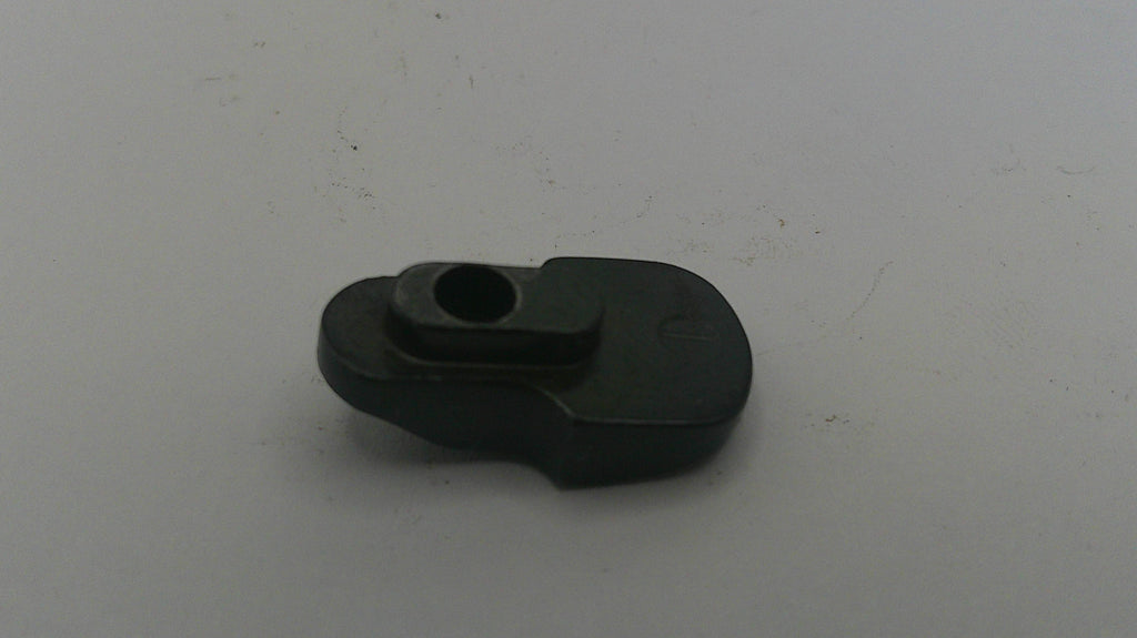 Black mechanical component on a white background