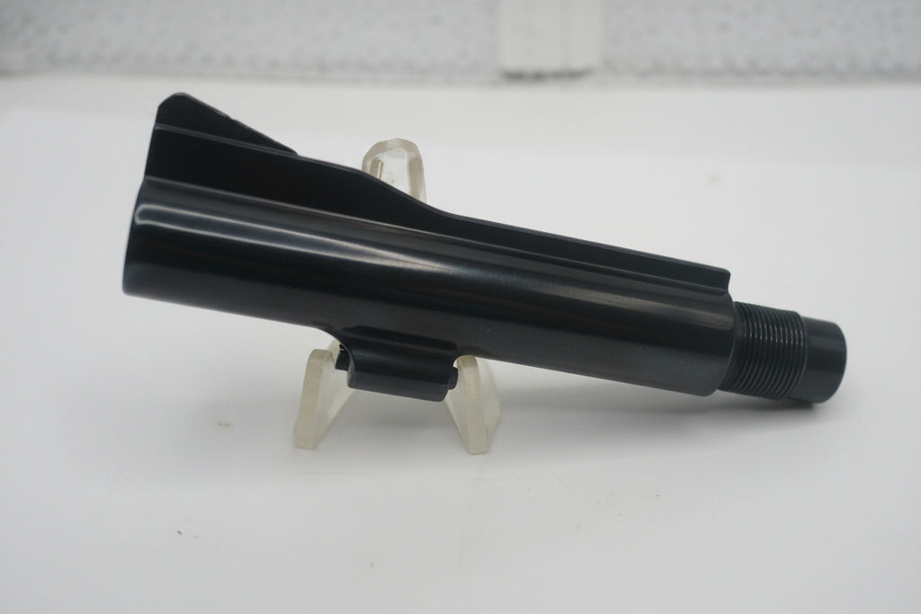 Black plastic component on a white background