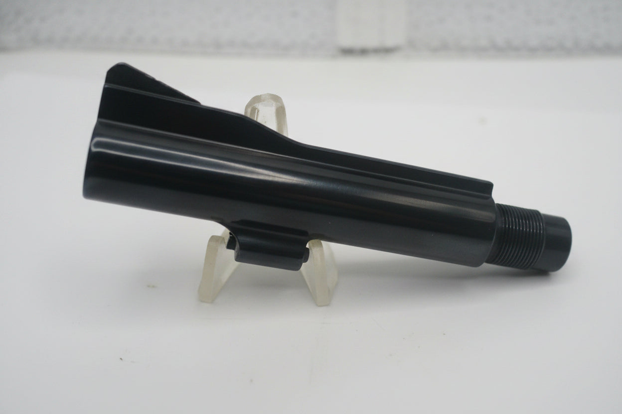 Black plastic component on a white background