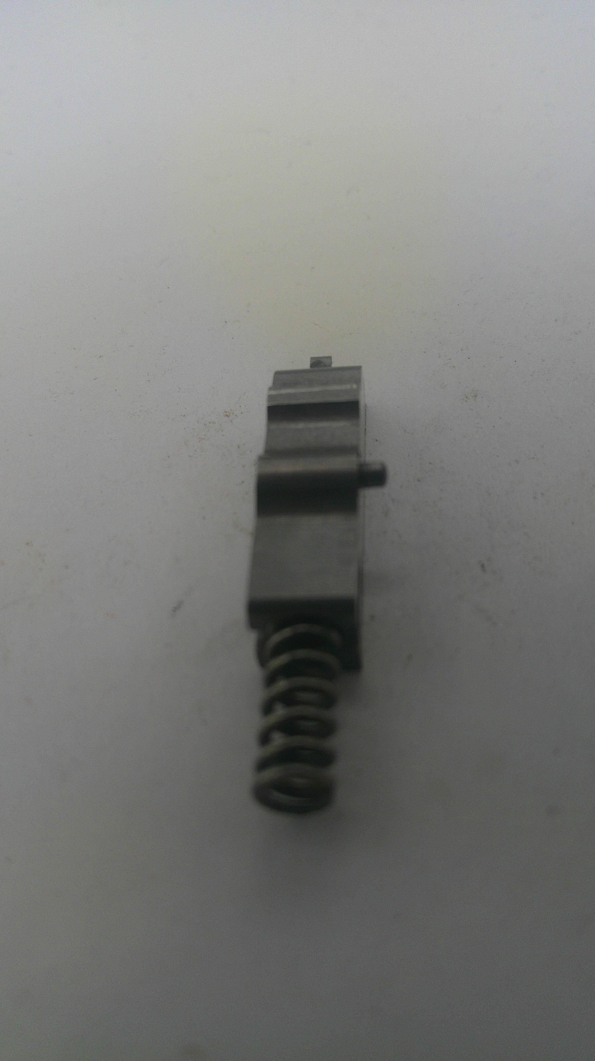 Metal spring and component on a white background