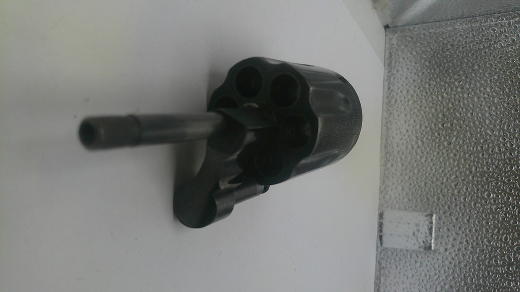 Black metal pipe fitting on a white background