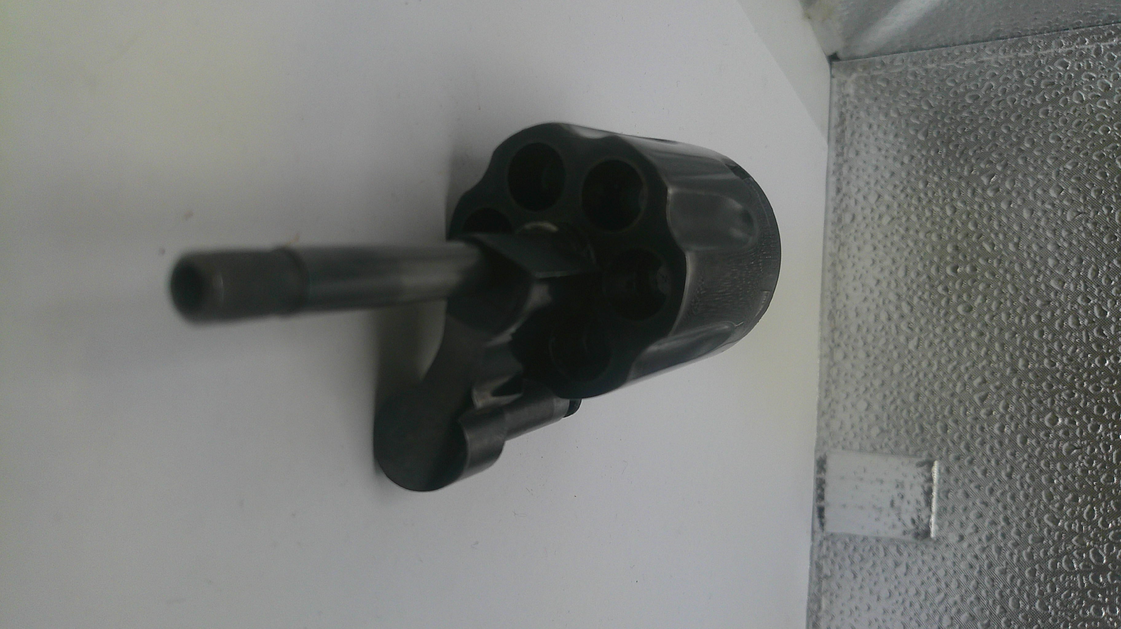 Black metal pipe fitting on a white background