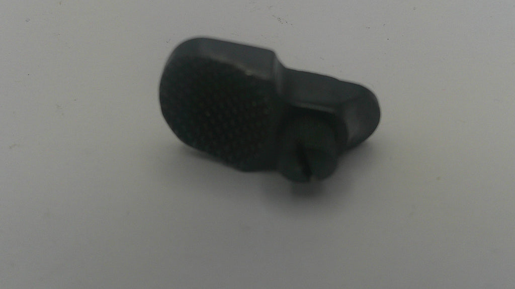 A small black plastic replacement part with a textured oval top and a cylindrical protruding end, shown on a plain light gray background.