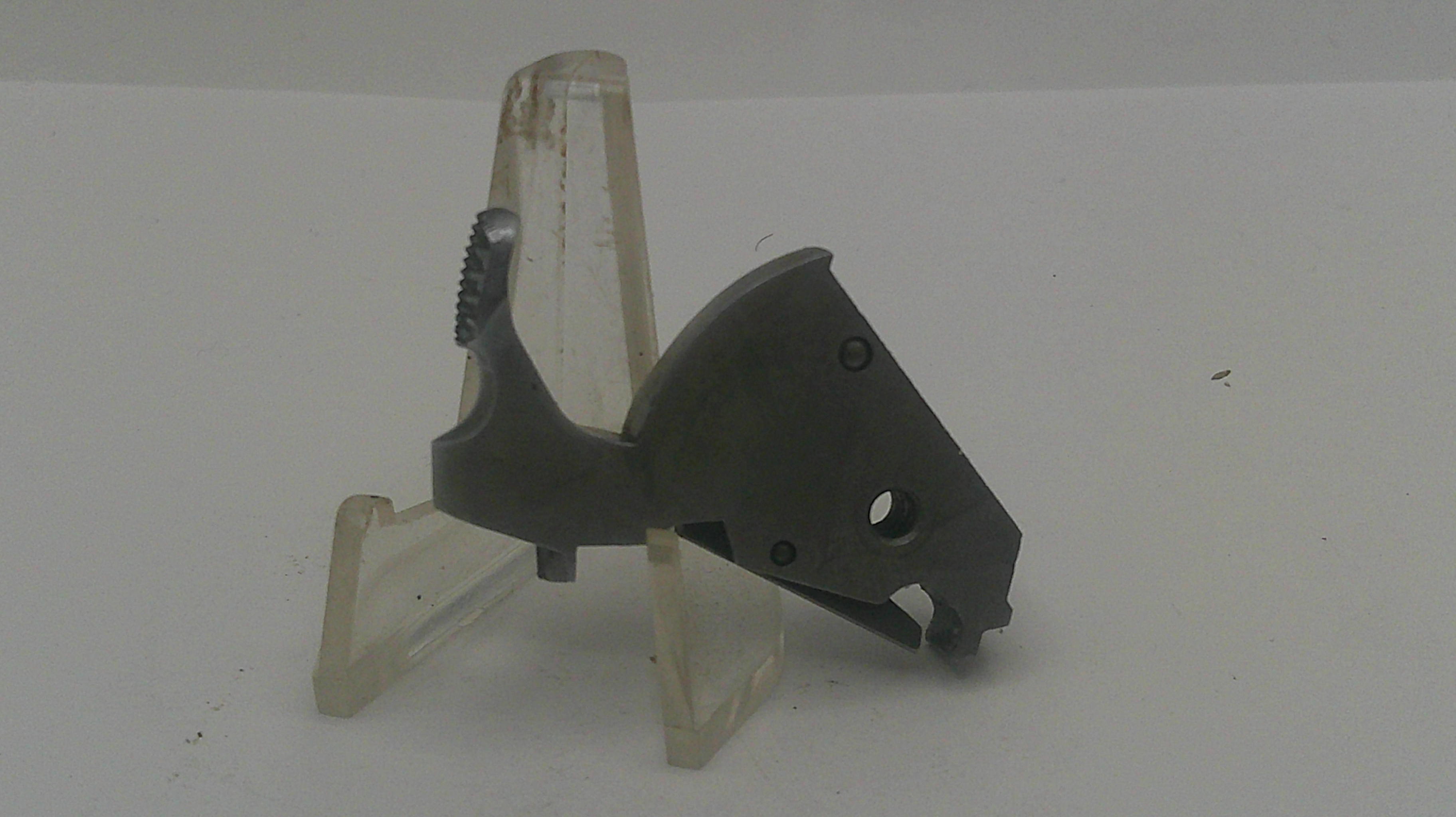 Black plastic component on a white background
