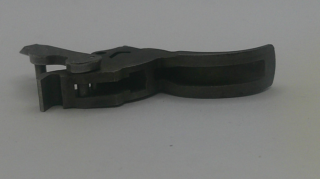 Black plastic component on a gray background