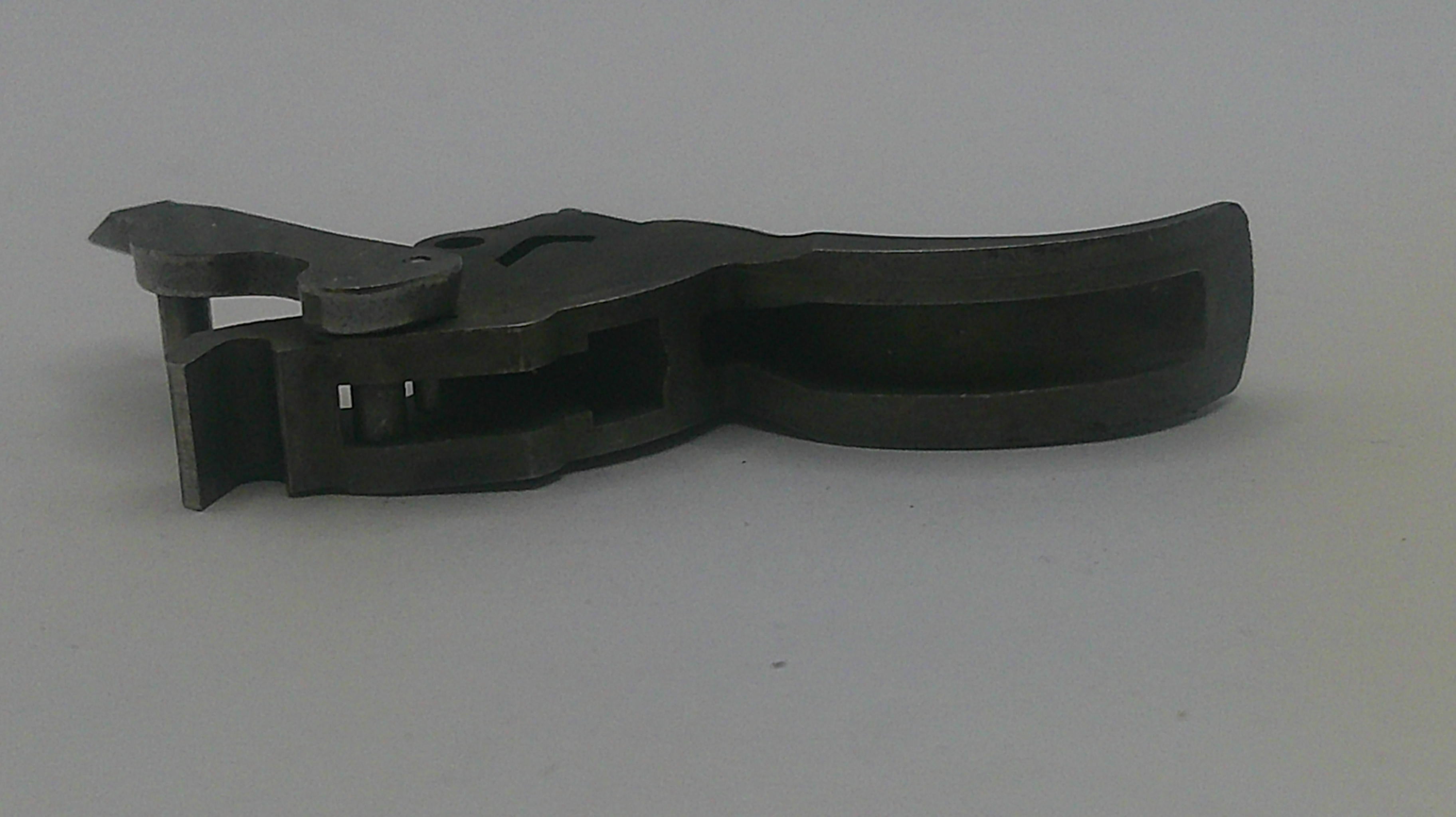Black plastic component on a gray background