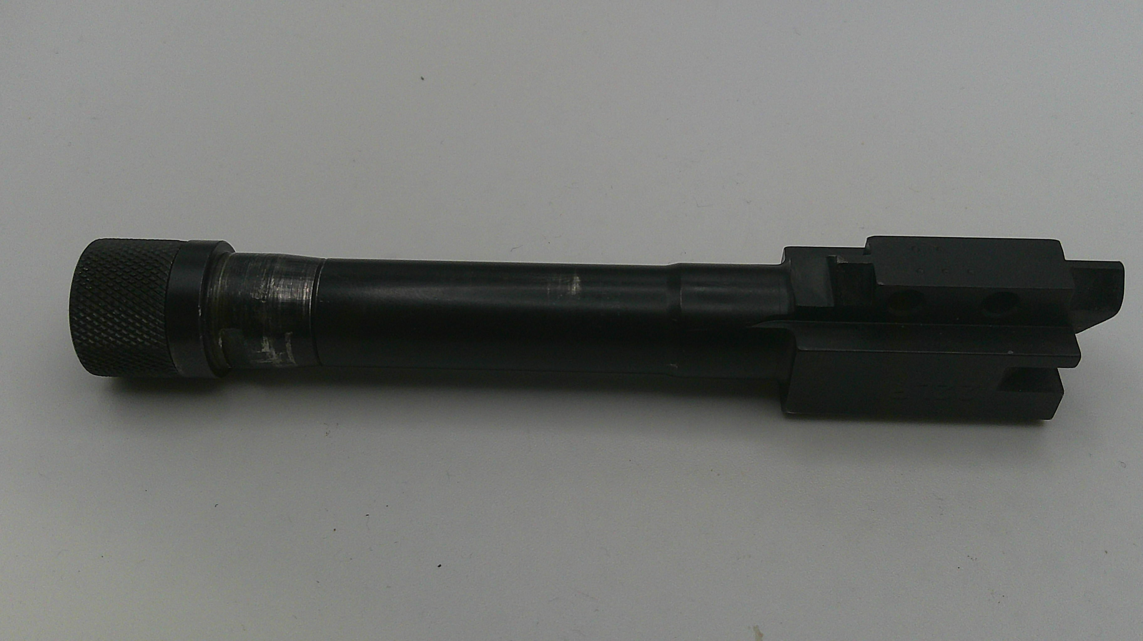 Black cylindrical object on a white background