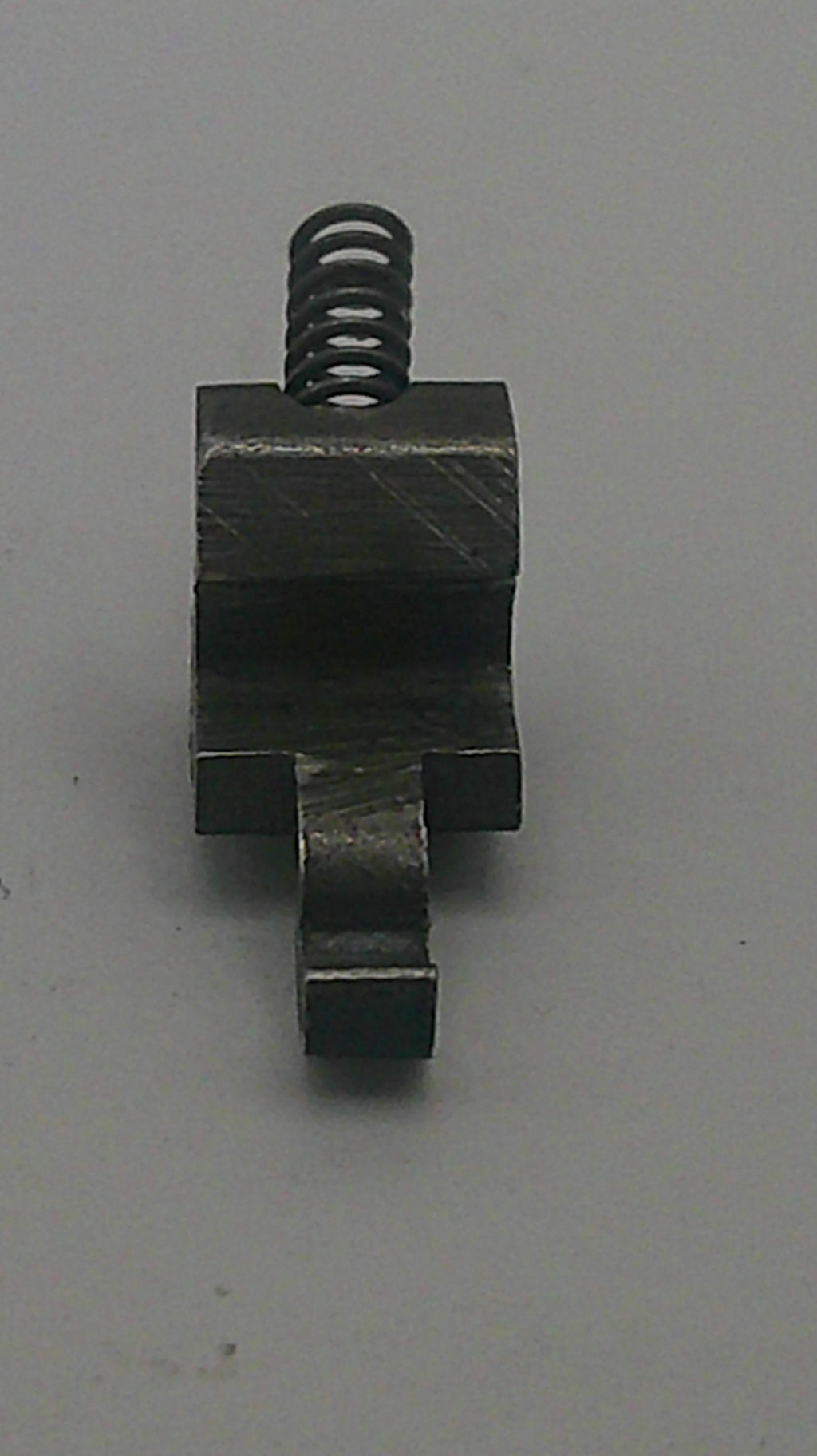 Metal mechanical component on a gray background