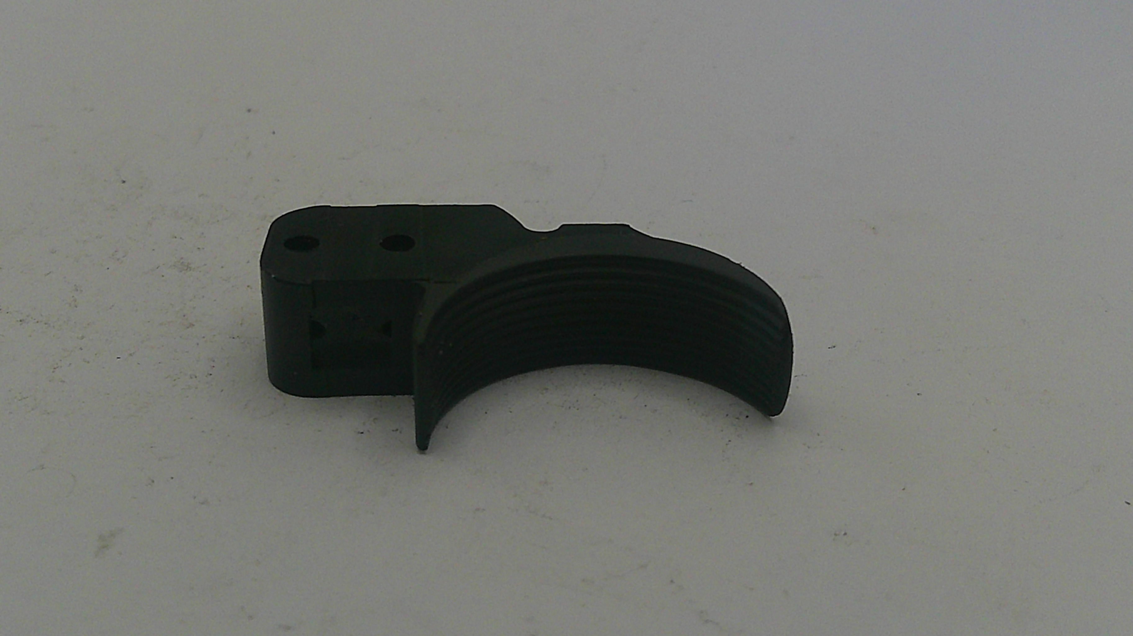 Black plastic component on a white background