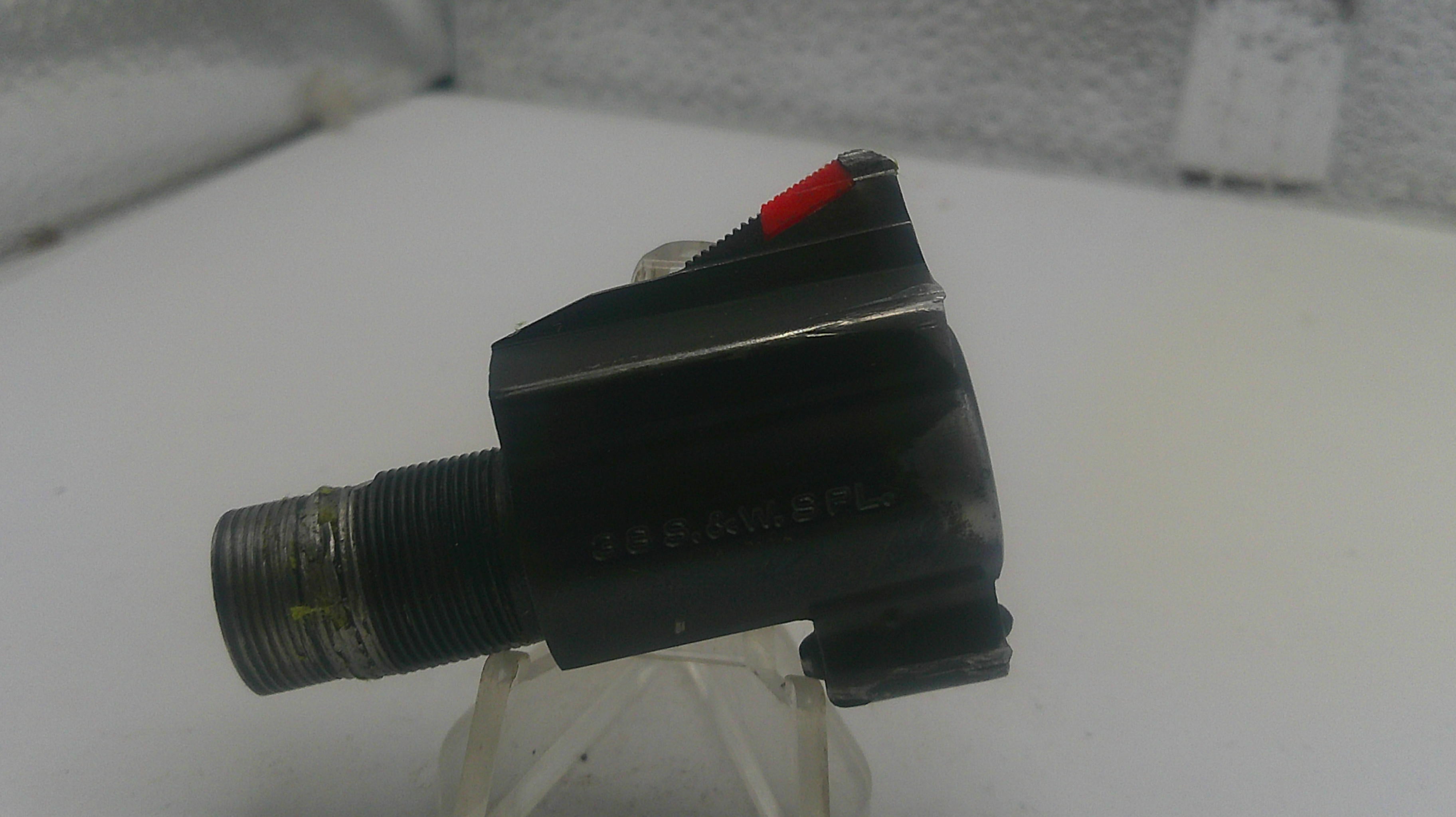 Mechanical component with a red indicator on a white background