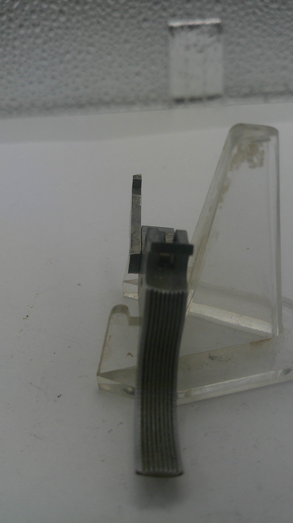 Small mechanical component on a white surface