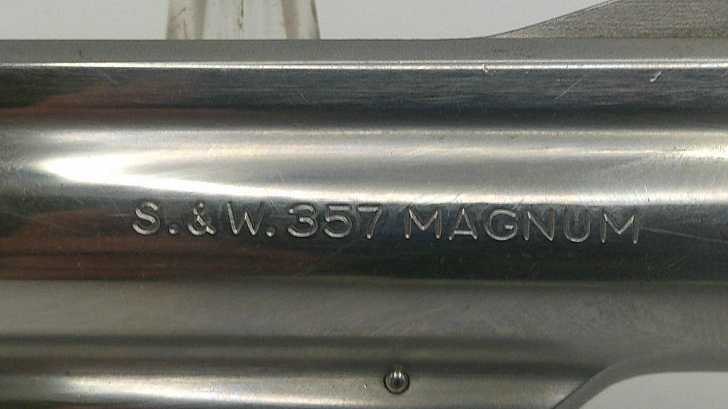 Close-up of a gun barrel with 'S.&W. 357 Magnum' engraving.