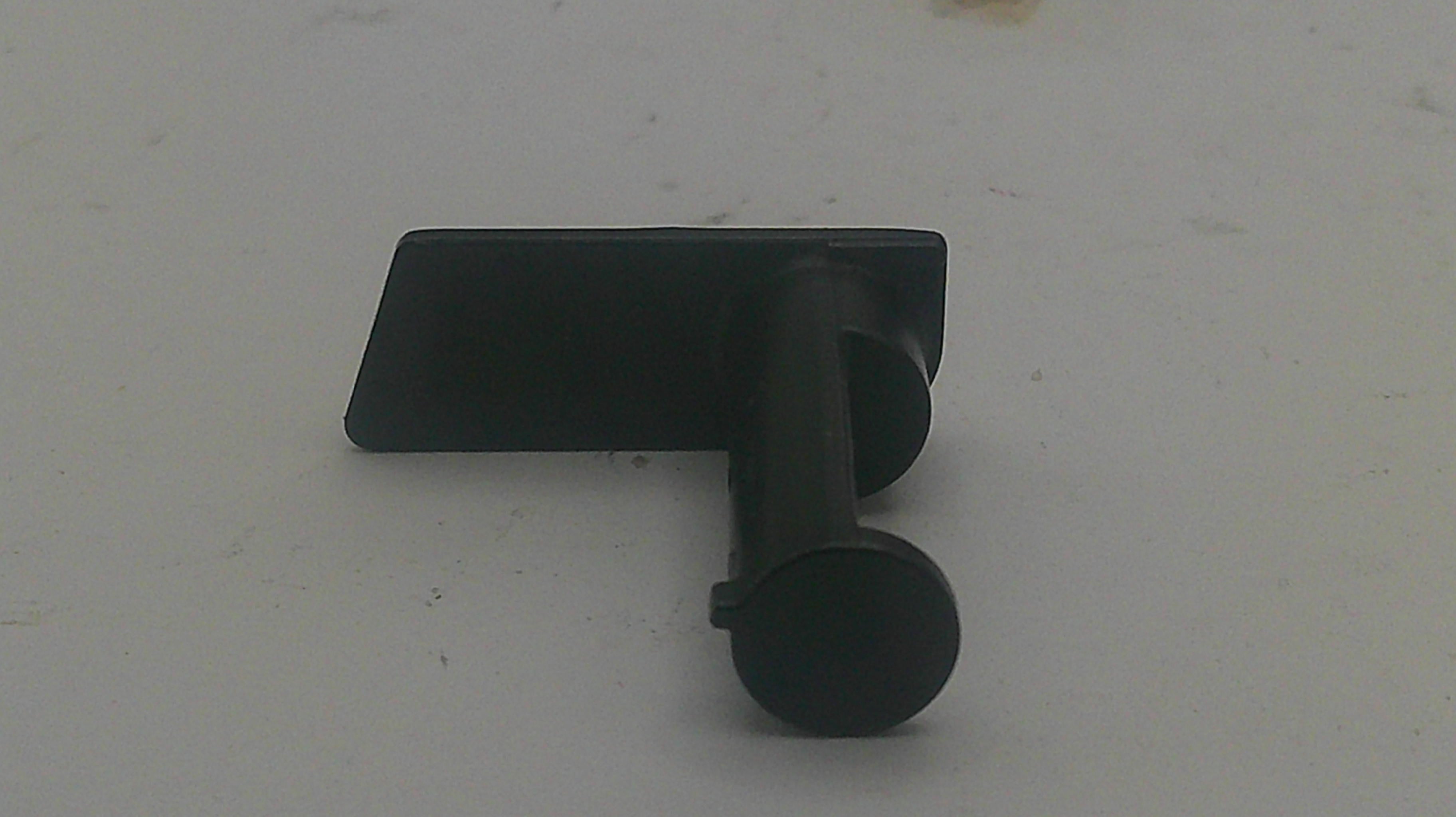 A black metal wall hook with a flat rectangular backplate and a cylindrical sleeve, shown on a plain light gray surface.