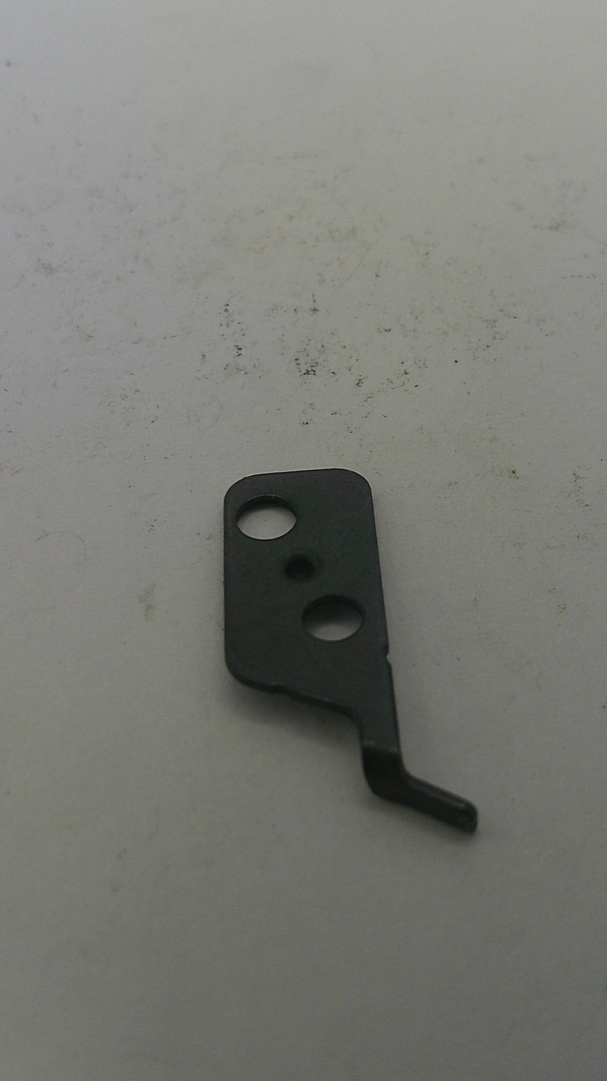 Black metal lever on a light gray background