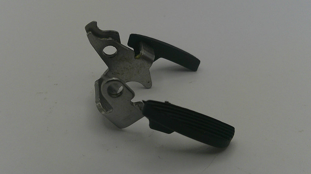 Metal and black mechanical component on a white background