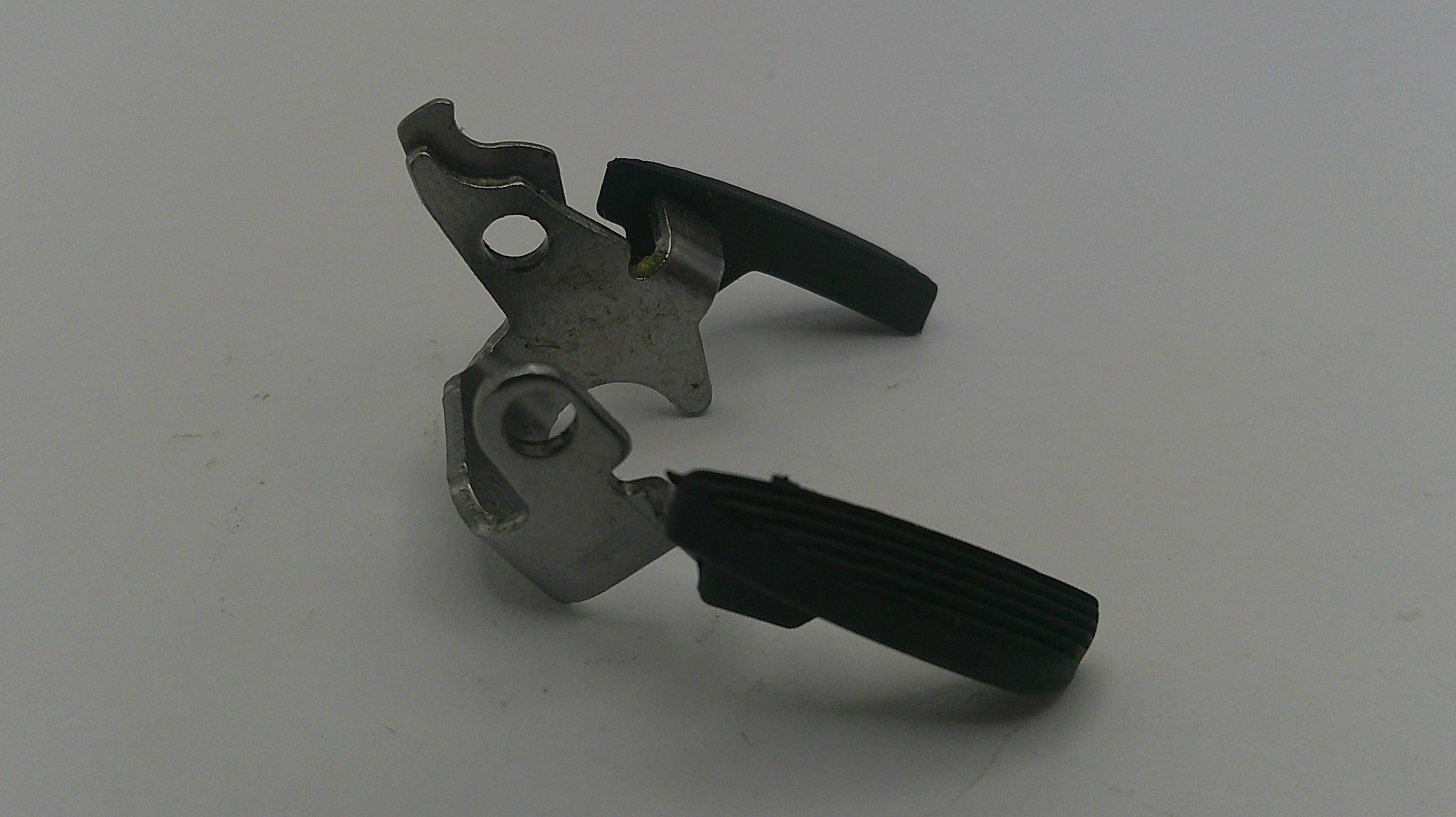 Metal and black mechanical component on a white background