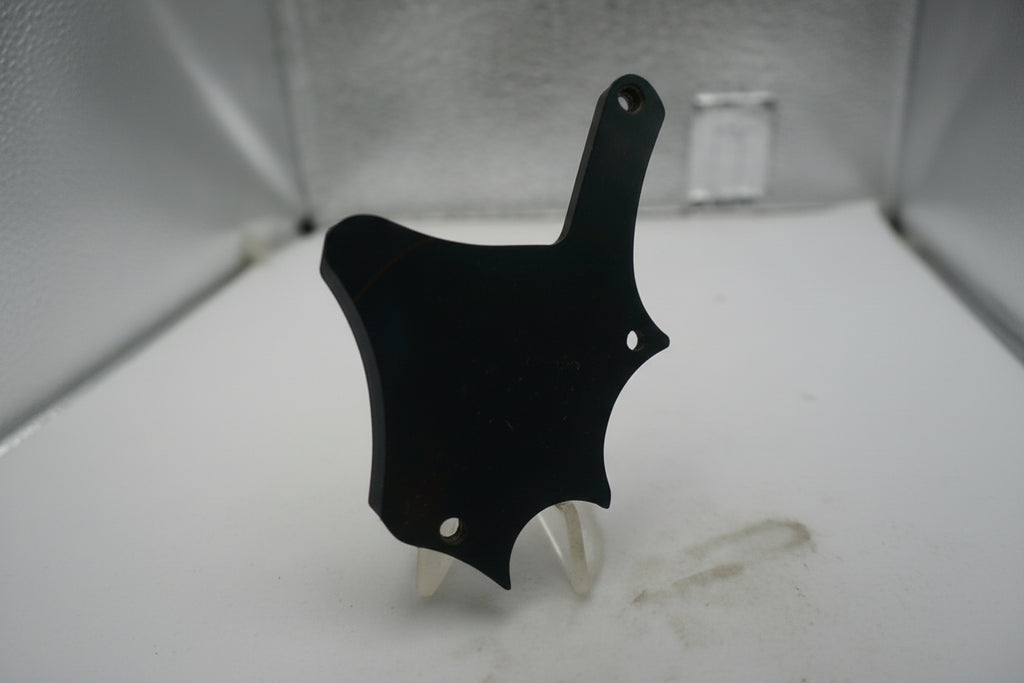 Black object on a textured white surface