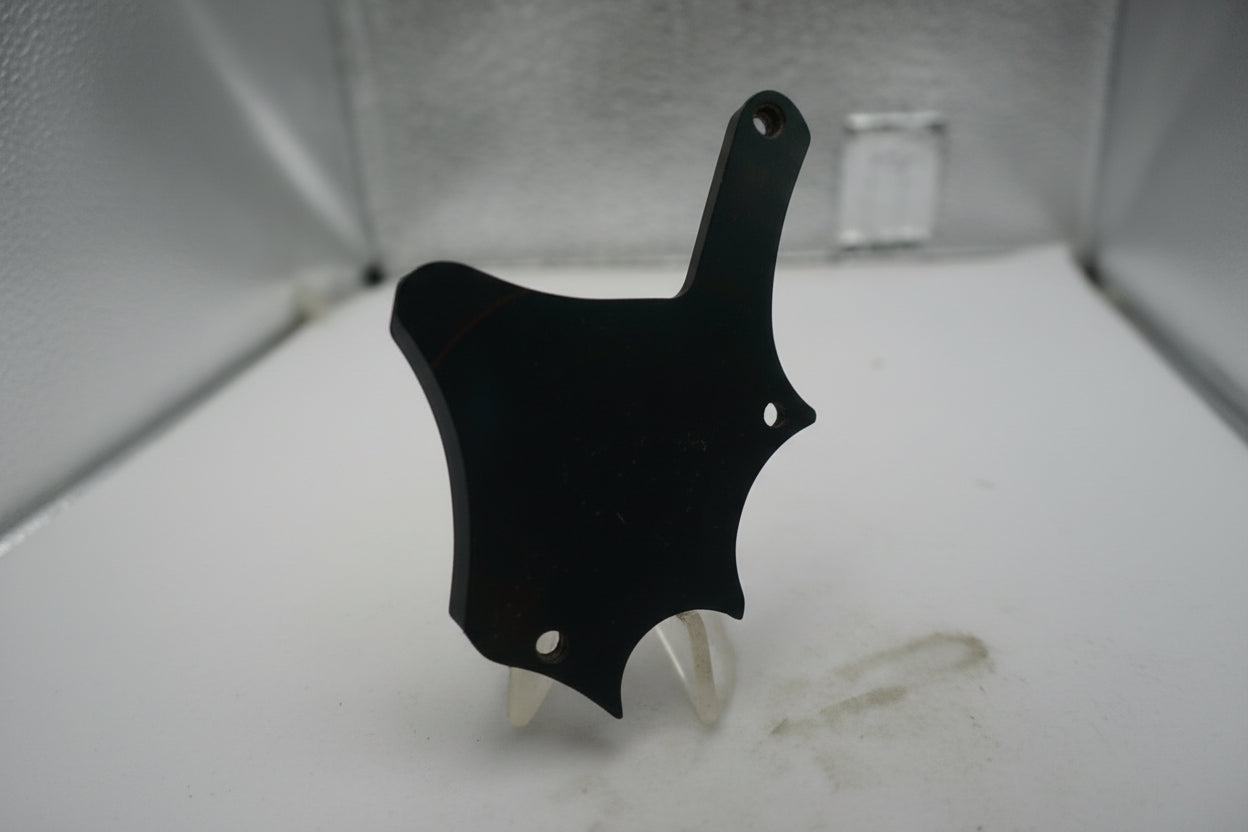 Black object on a textured white surface