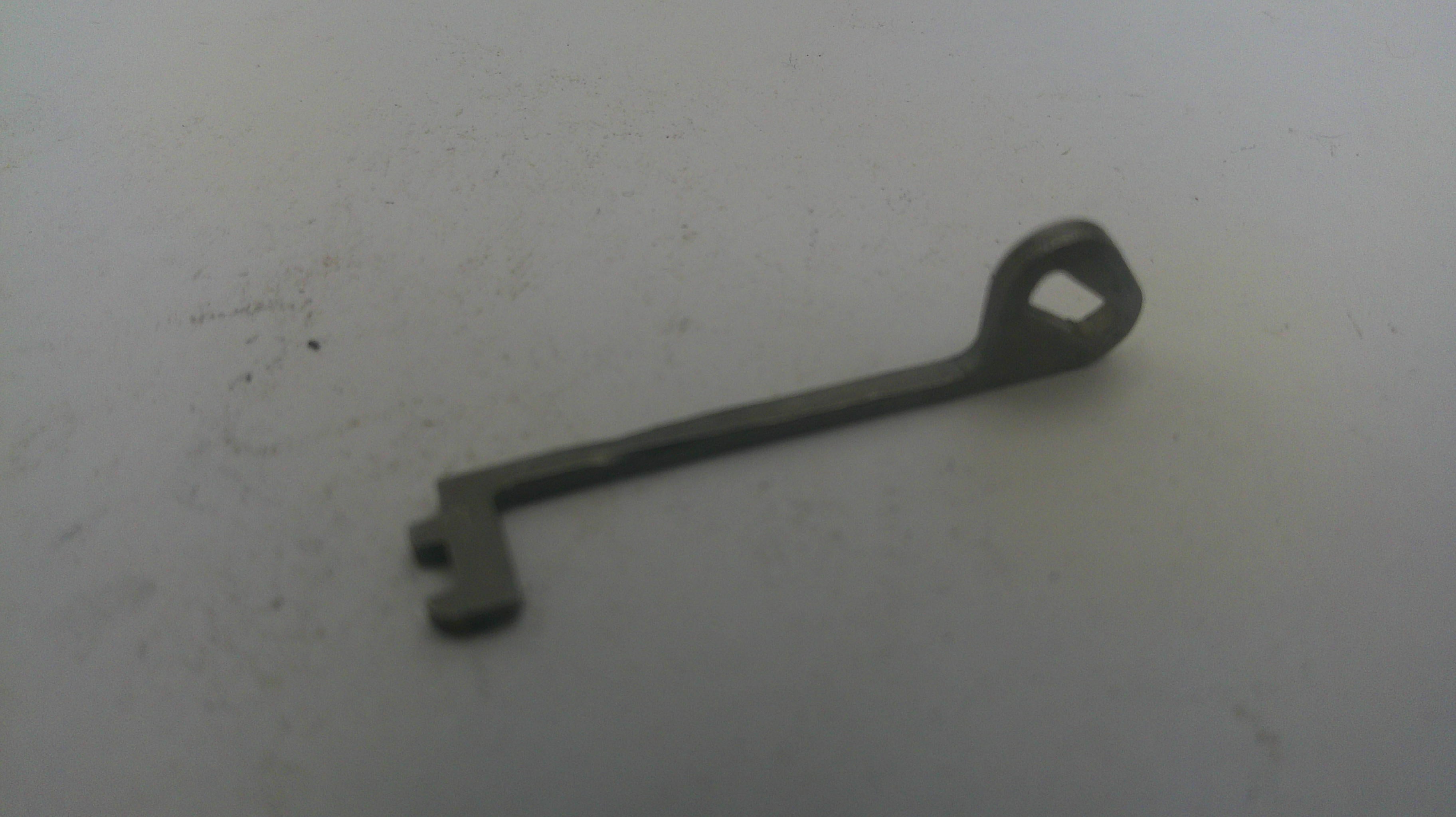 Vintage key on a light gray background