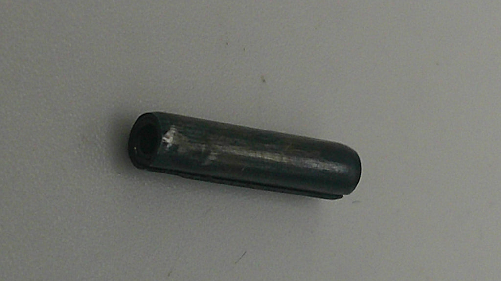 Black cylindrical object on a gray background