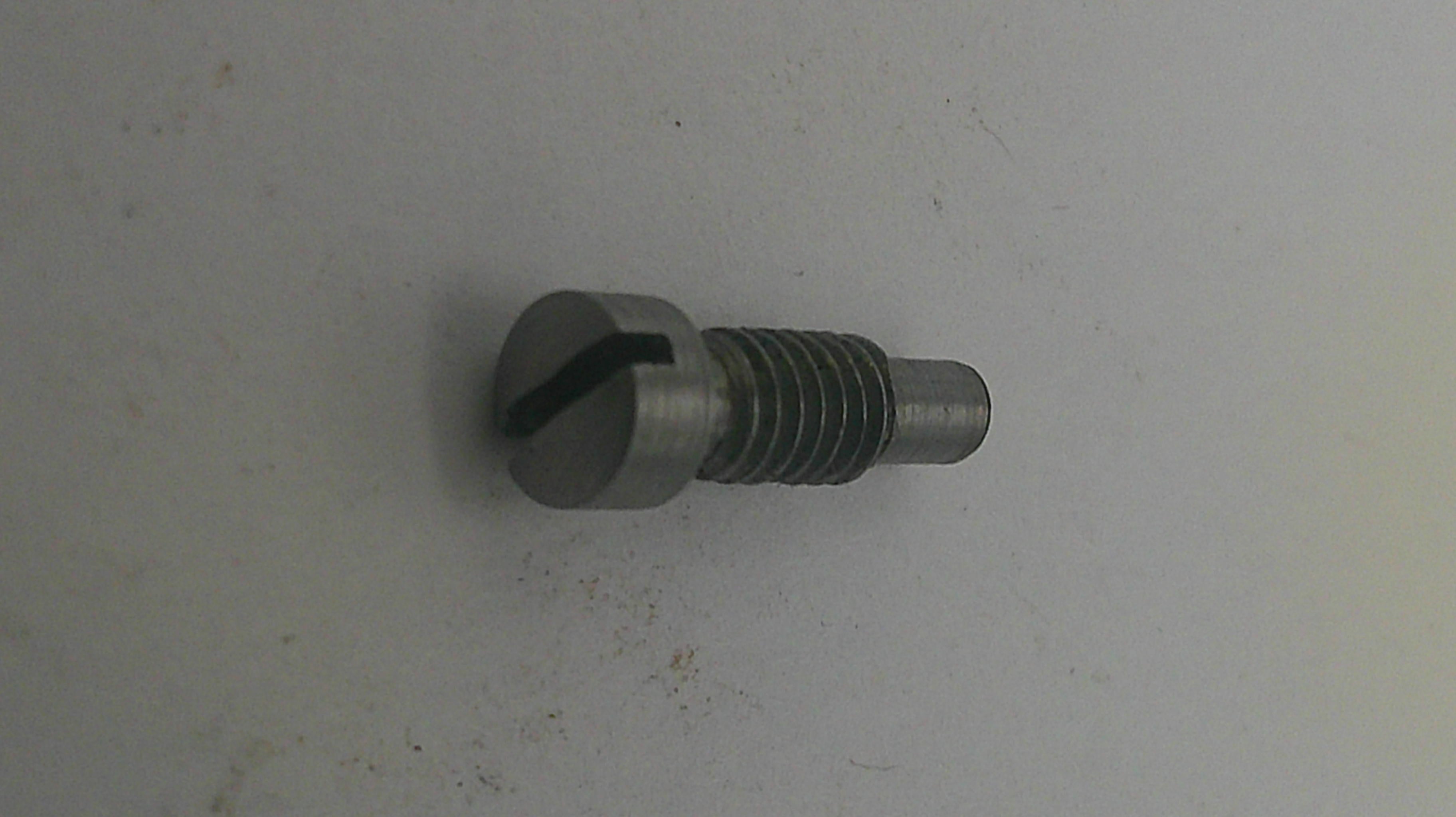 Metal screw on a light gray background