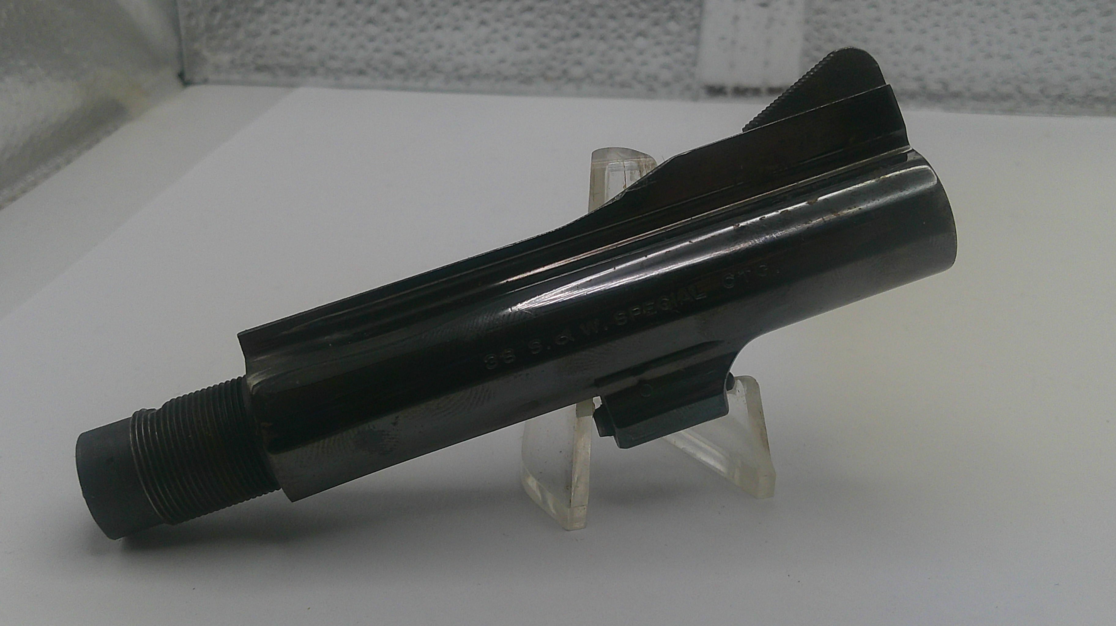 Black object on a stand against a light background