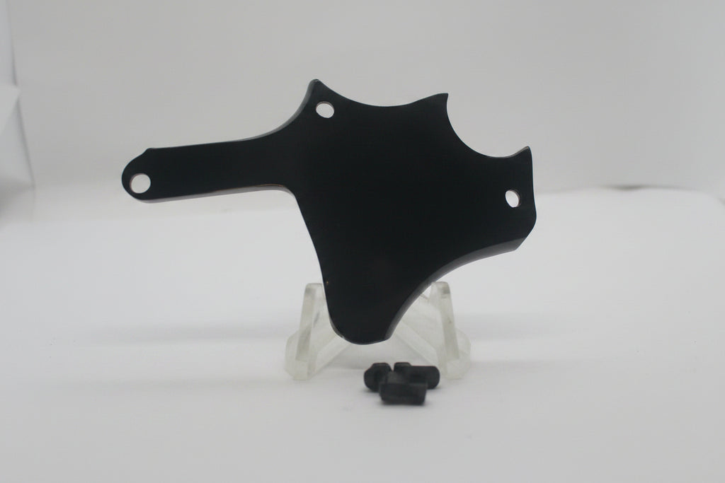 A glossy black plastic motorcycle or bicycle handlebar clip or guard, displayed on a small clear stand with a small black hardware piece in front, set against a plain white background.