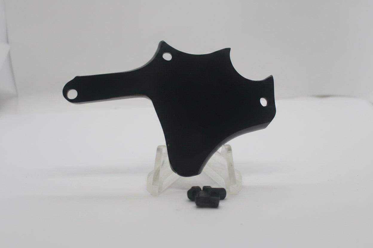 A glossy black plastic motorcycle or bicycle handlebar clip or guard, displayed on a small clear stand with a small black hardware piece in front, set against a plain white background.