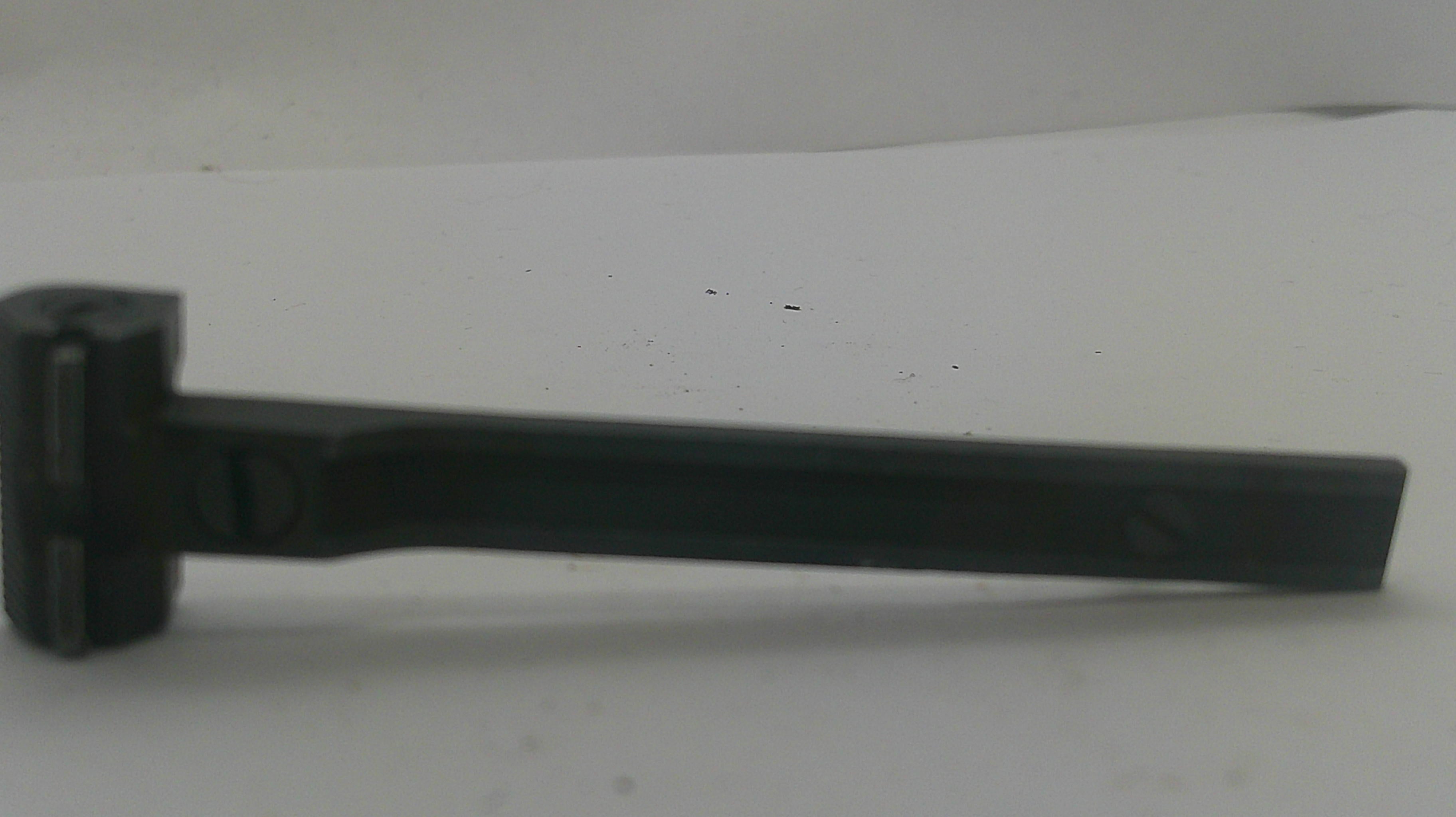 A black metal tool with a flat rectangular head and a long straight handle, photographed on a plain light background.