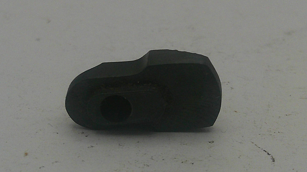 Black rubber grommet on a light gray background