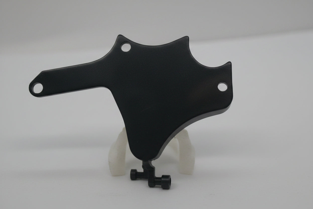 A black metal mounting bracket or hardware piece with pre-drilled holes, shown on a plain light gray background.