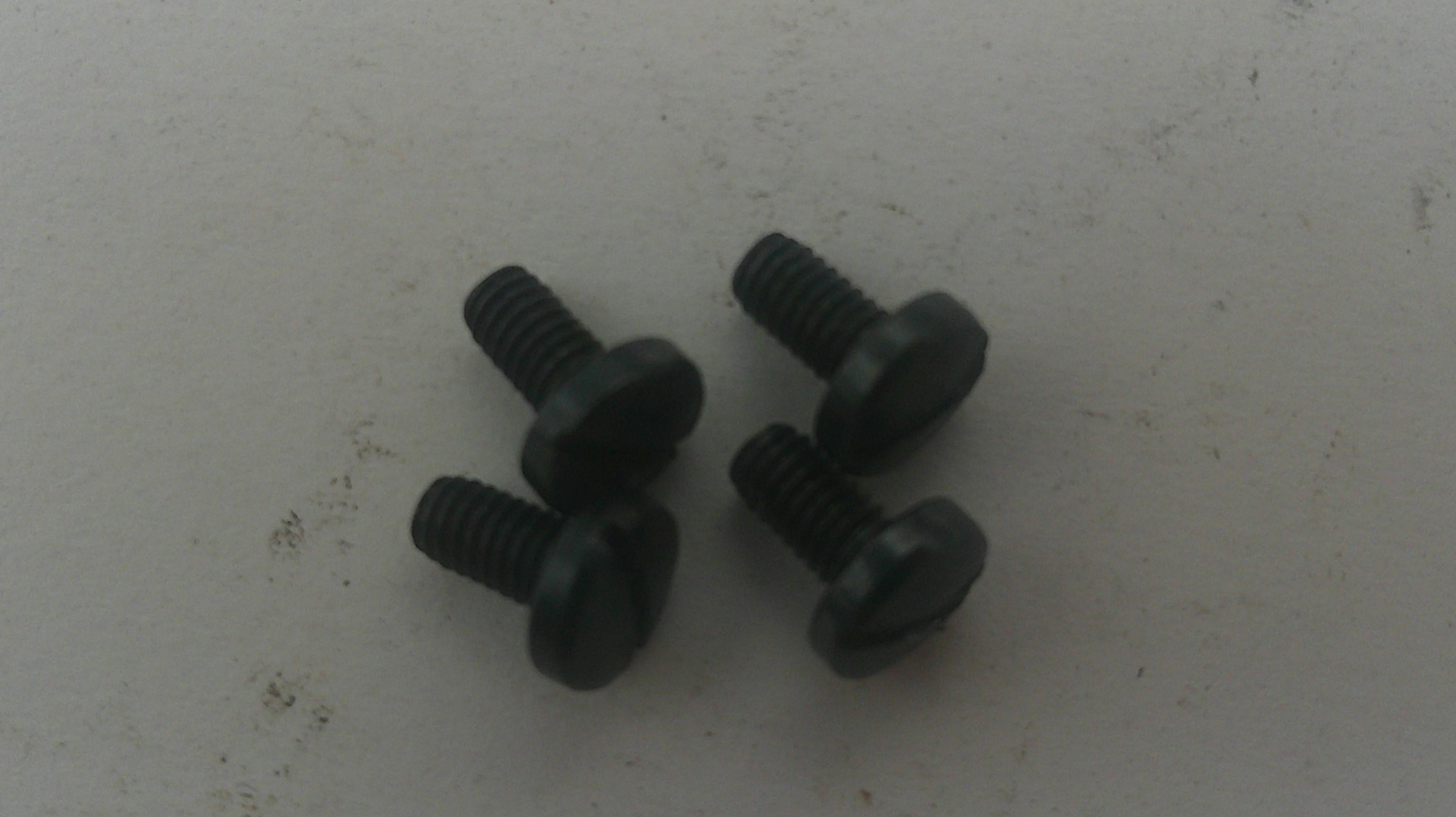 Two black screws on a light gray background