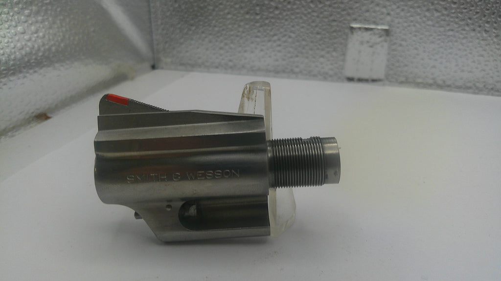 Metal mechanical component on a white surface with a textured background