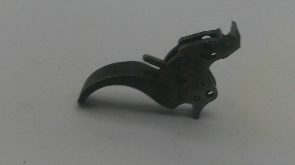 Black firearm trigger on a white background