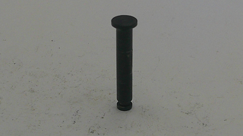 Black cylindrical object on a light gray background