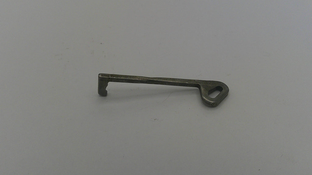 Metal key on a gray background