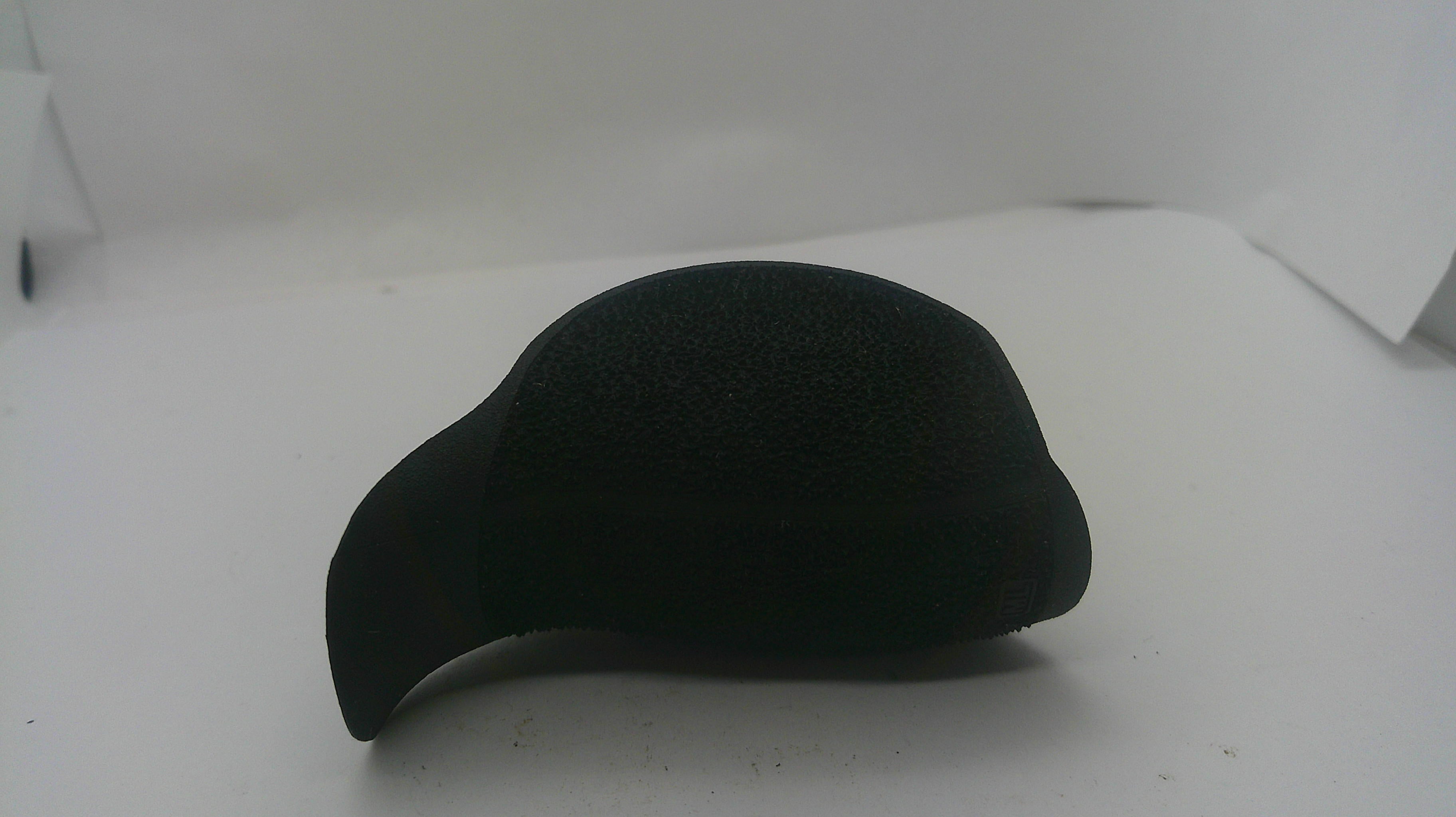 A black textured foam or sponge cap-shaped object, possibly a protective headguard or impact absorber, shown on a plain white background.