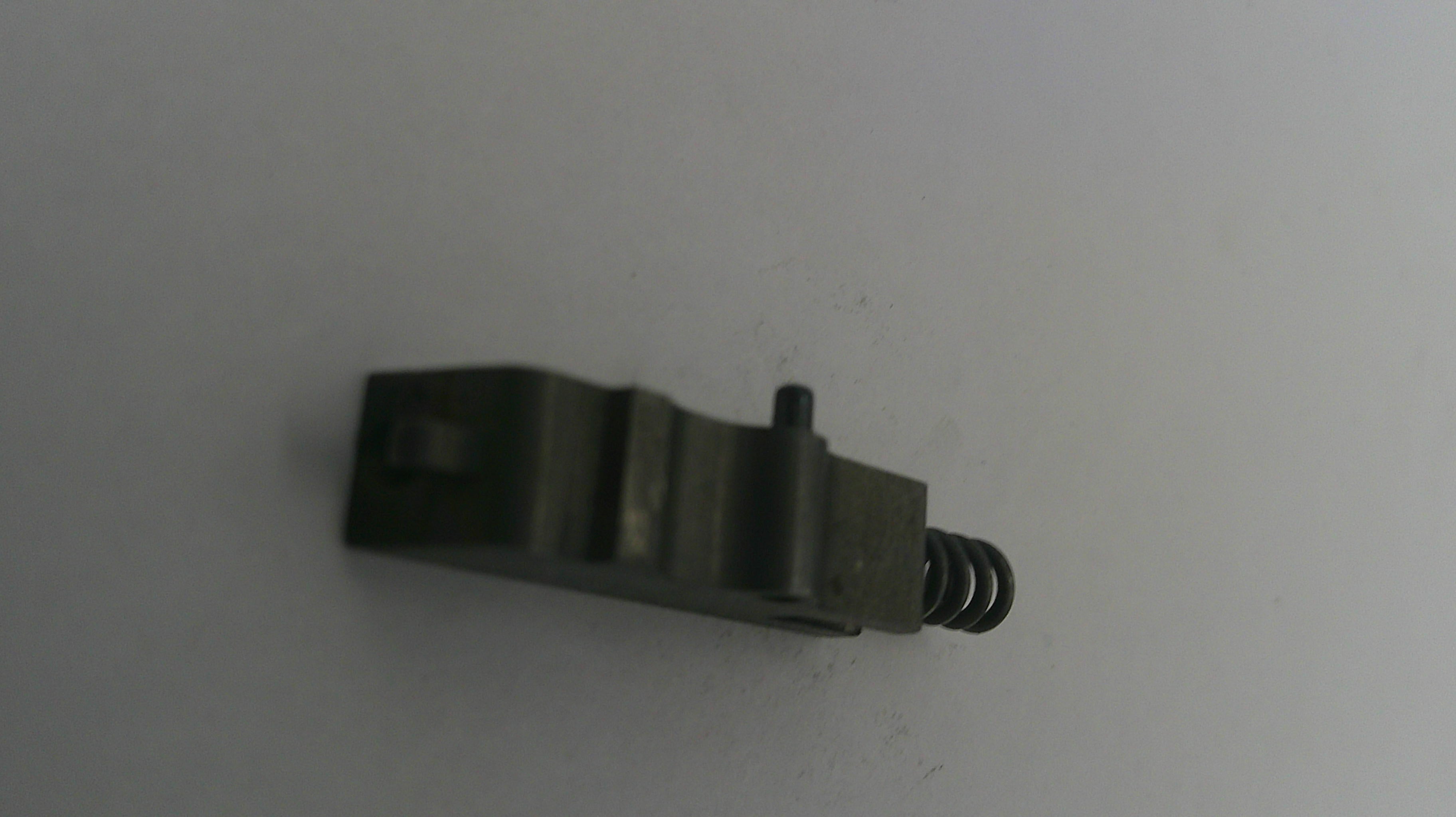 Small metal component on a white background
