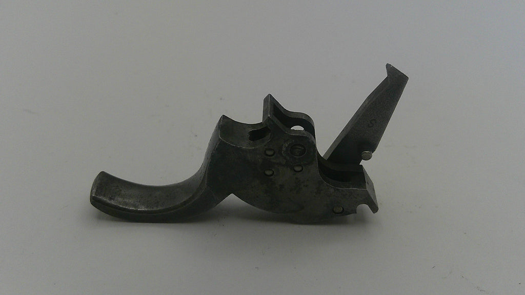 Metallic gun part on a white background