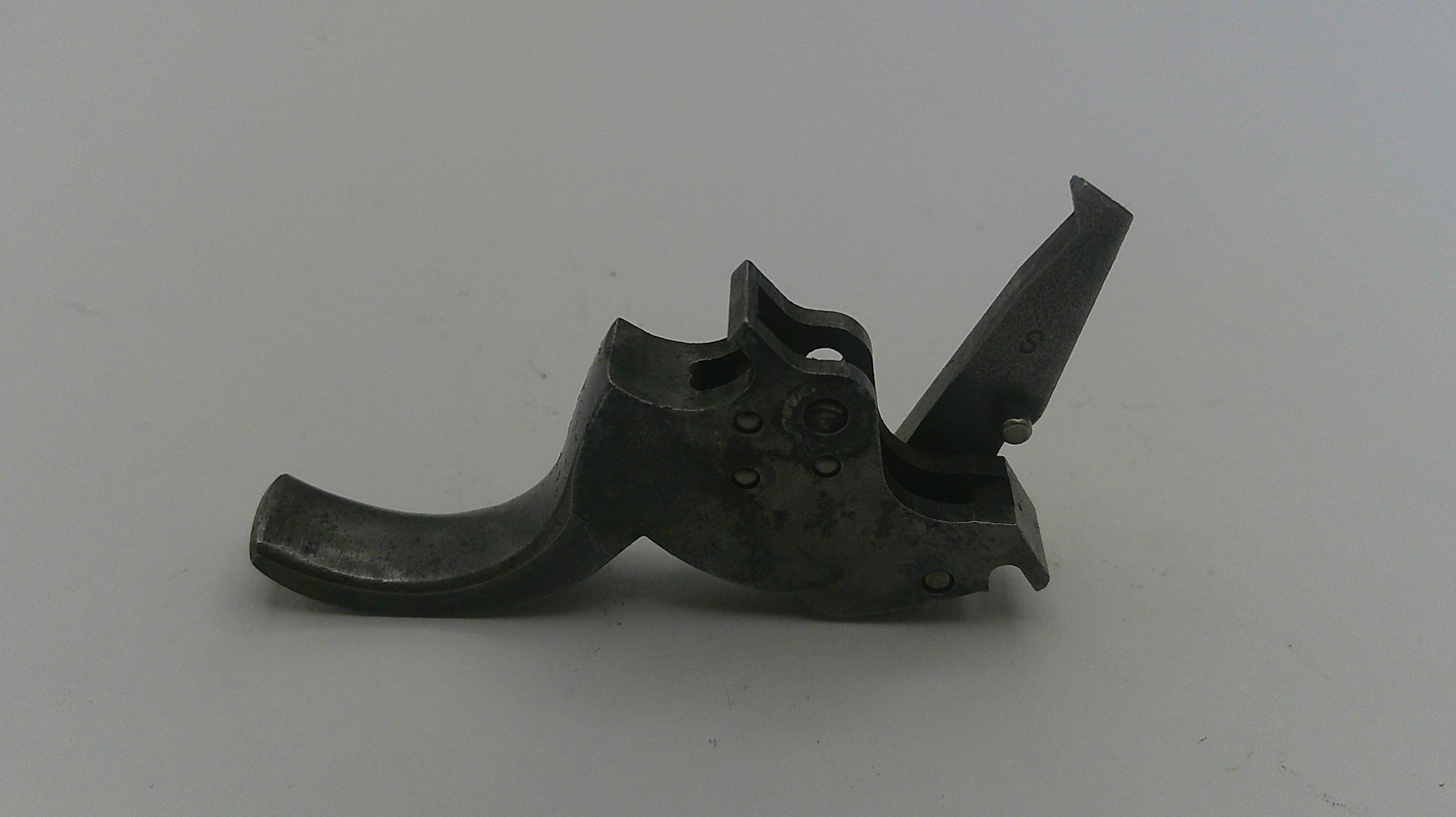 Metallic gun part on a white background