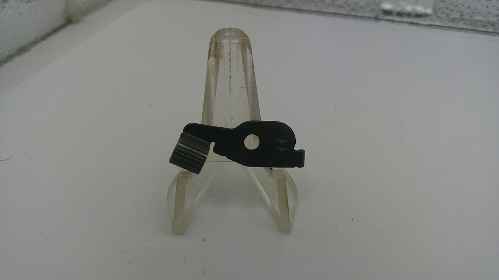 Small metal bracket on a white surface