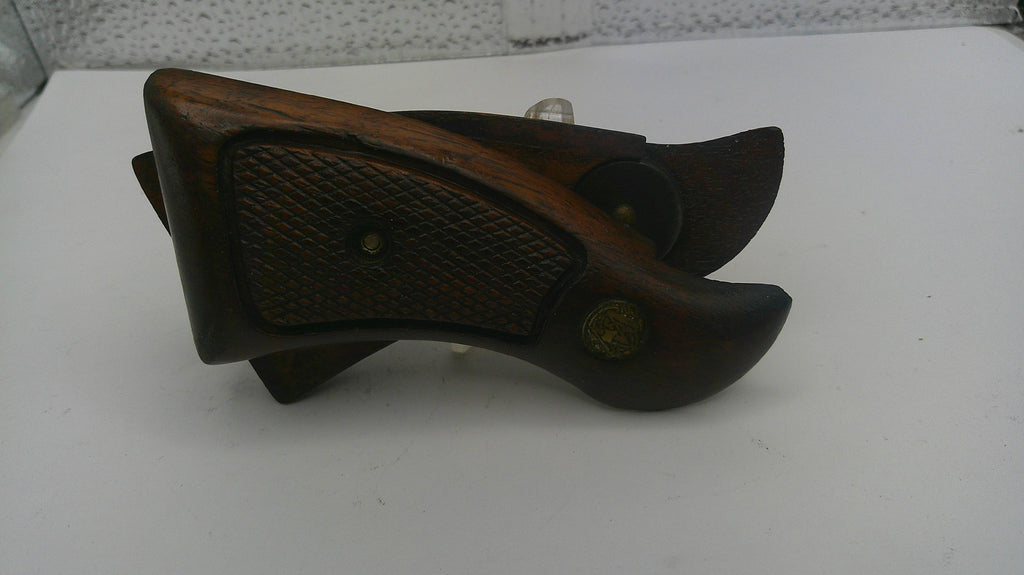 Wooden shoe last on a white surface with a blurred background